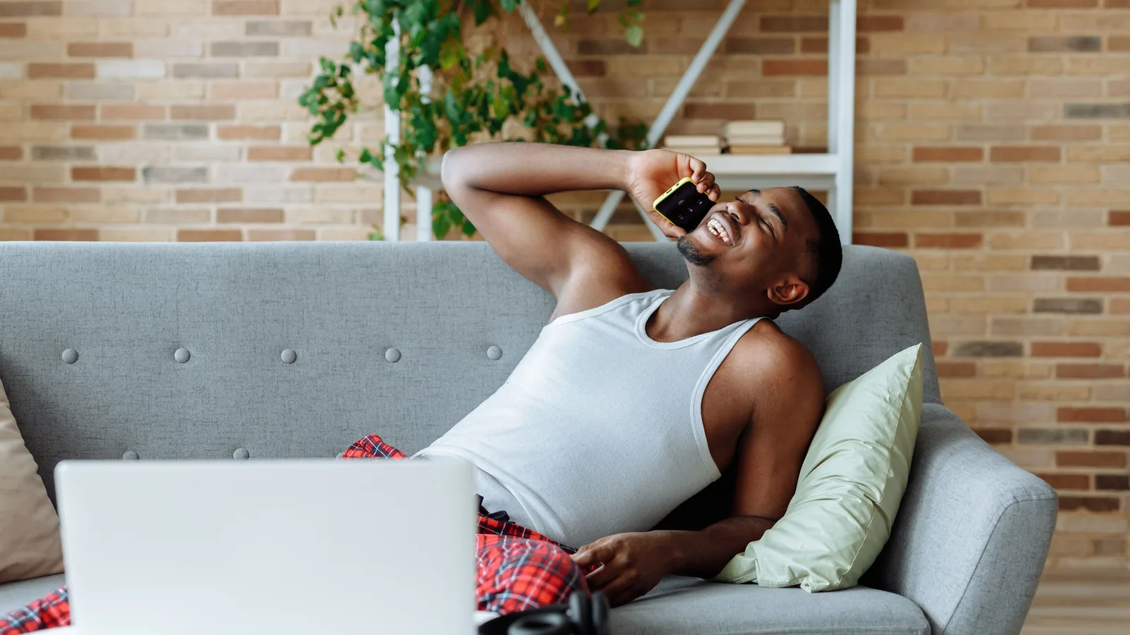 Man taking a lender follow-up call at home