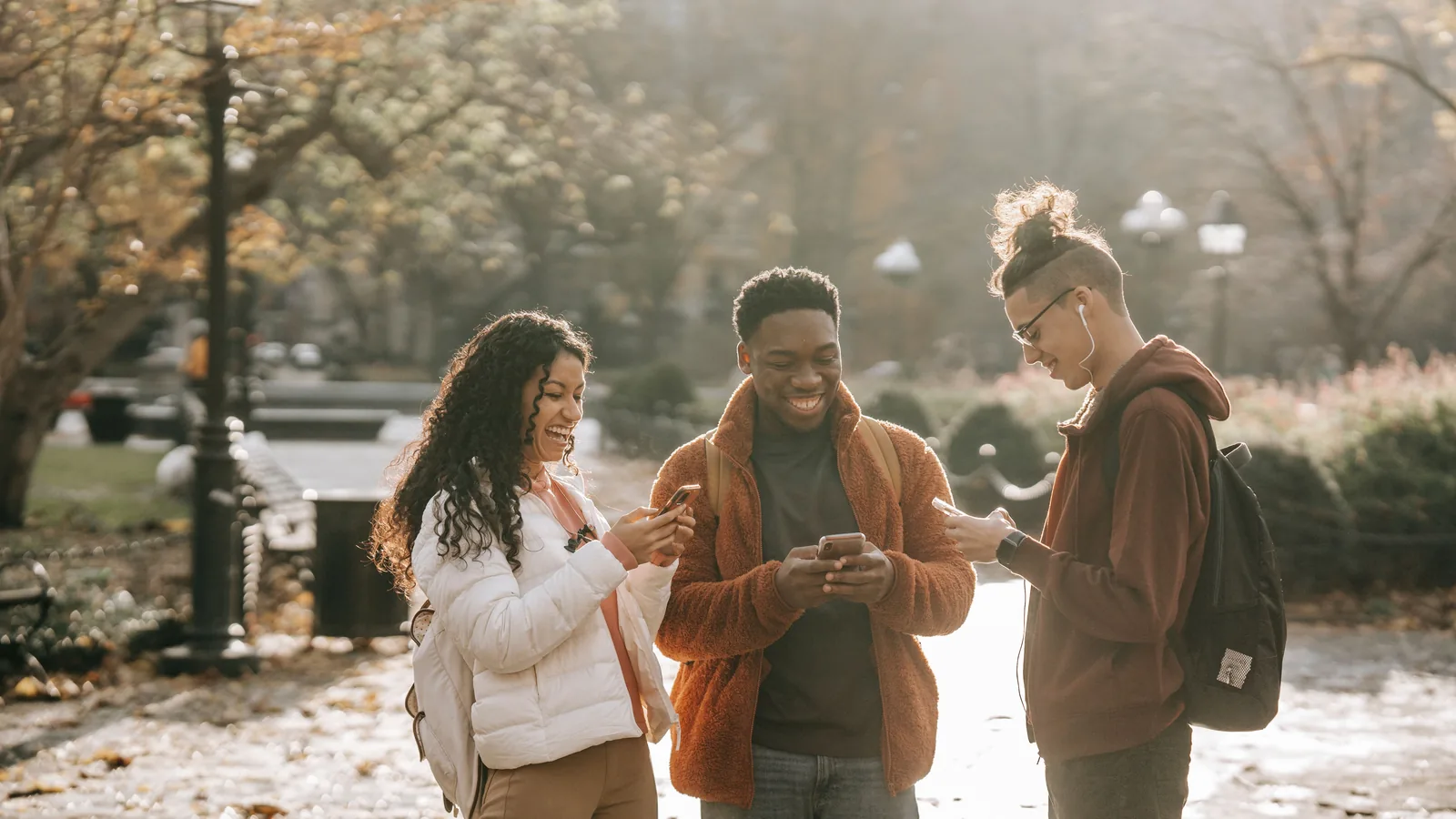 Young people checking AmONE Loans options on their phones