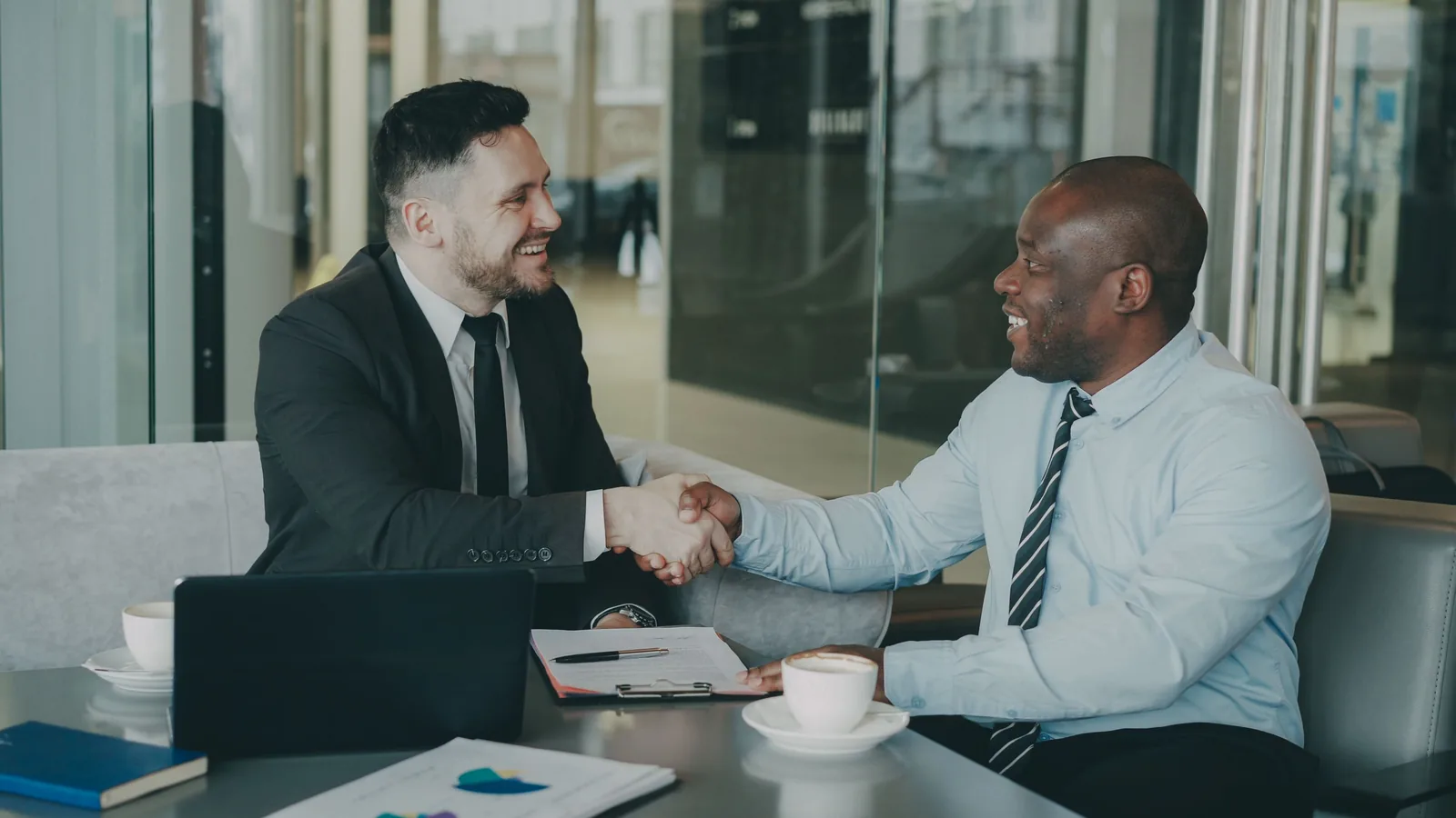 Handshake representing AmONE Loans partner lenders